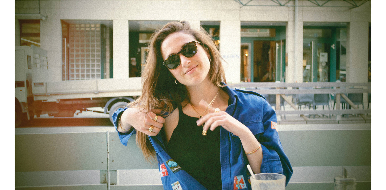 Andrea is wearing our gold Brooklyn necklace. She also wears L'Amour necklace and a few of our gold signet rings. All our gold jewelry are made of a high-quality 24 karat gold plating.