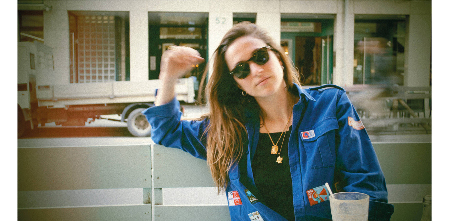 Andrea is wearing our gold Brooklyn necklace. She also wears L'Amour necklace and a few of our gold signet rings. All our gold jewelry are made of a high-quality 24 karat gold plating.