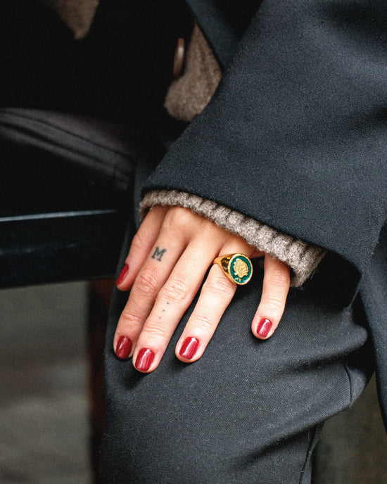 Atelier Domingo's is releasing a new version of its classic Do's ring. It is now available with a pine green handmade enamel.