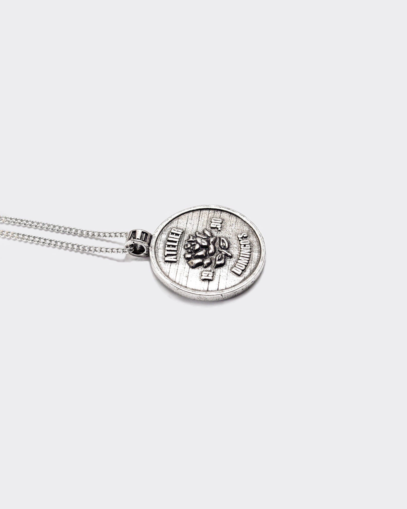 Atelier Domingo's State of Mind silver necklace is designed in France and made in Spain. This necklace is unisex, made for both men and women. The pendant is made of a high-quality 925 Sterling silver plating. The cuban chain is made of solid 925 Sterling silver.