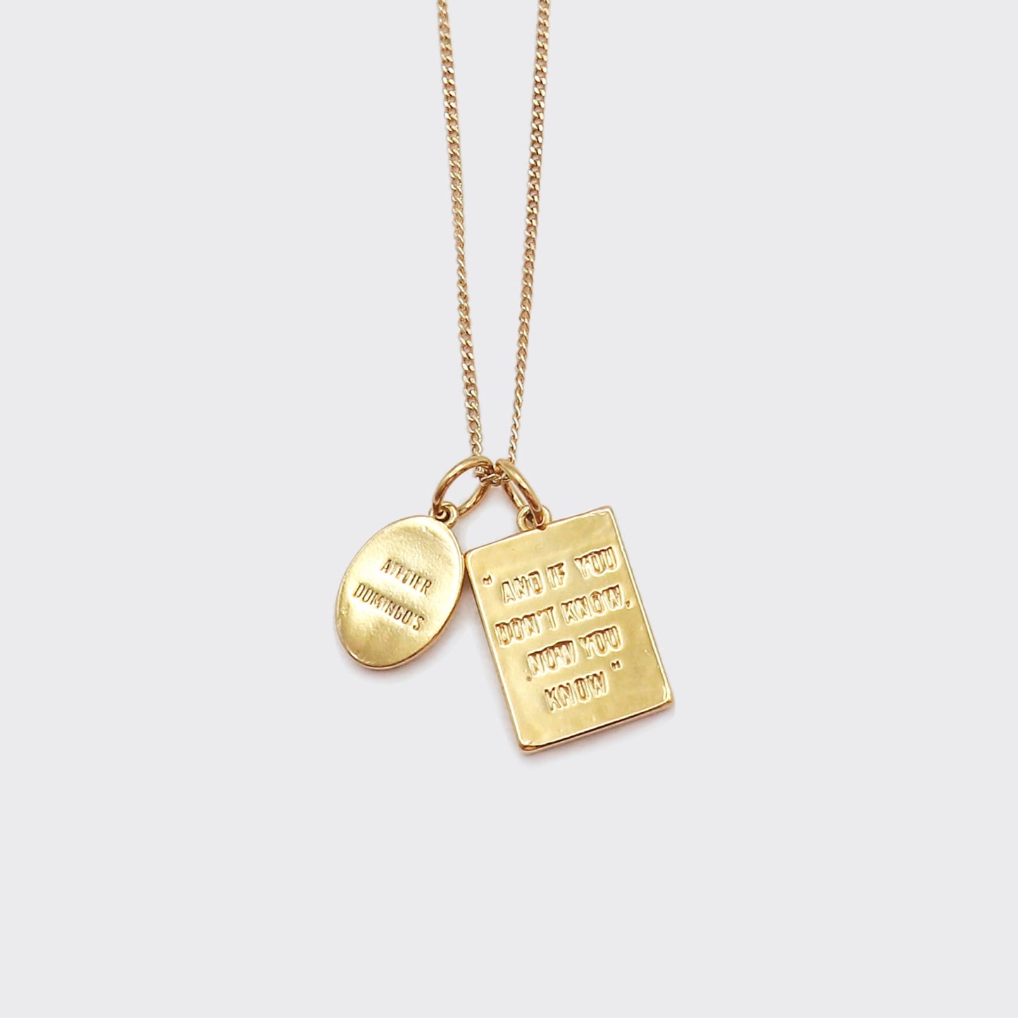 Atelier Domingo's Wallace necklace is a tribute to Christopher Wallace, a.k.a The Notorious B.I.G. Made in Spain, this jewelry is designed to be unisex, for both men and women. The pendant is made of a high-quality 24 karat gold plating. The cuban chain is made of solid 925 Sterling silver with a high-quality 18 karat gold plating.