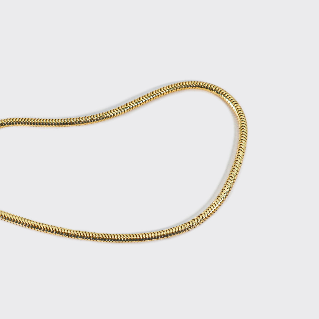 Atelier Domingo's Mamba gold bracelet is made of solid 925 Sterling silver with a high-quality 18 karat gold plating. This unisex bracelet is the classic snake chain. This jewelry is made in Italy and designed to be a bracelet for both men and women.