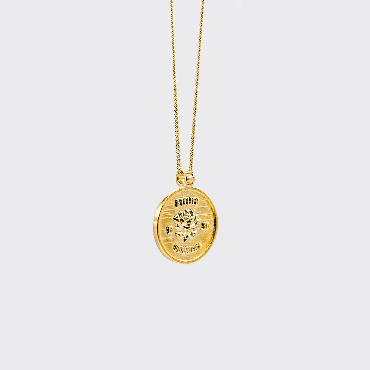 Atelier Domingo's State of Mind gold necklace is designed in France and made in Spain. This necklace is unisex, made for both men and women. The pendant is made of a high-quality 24 karat gold plating. The cuban chain is made of solid 925 Sterling silver with a high-quality 18 karat gold plating.