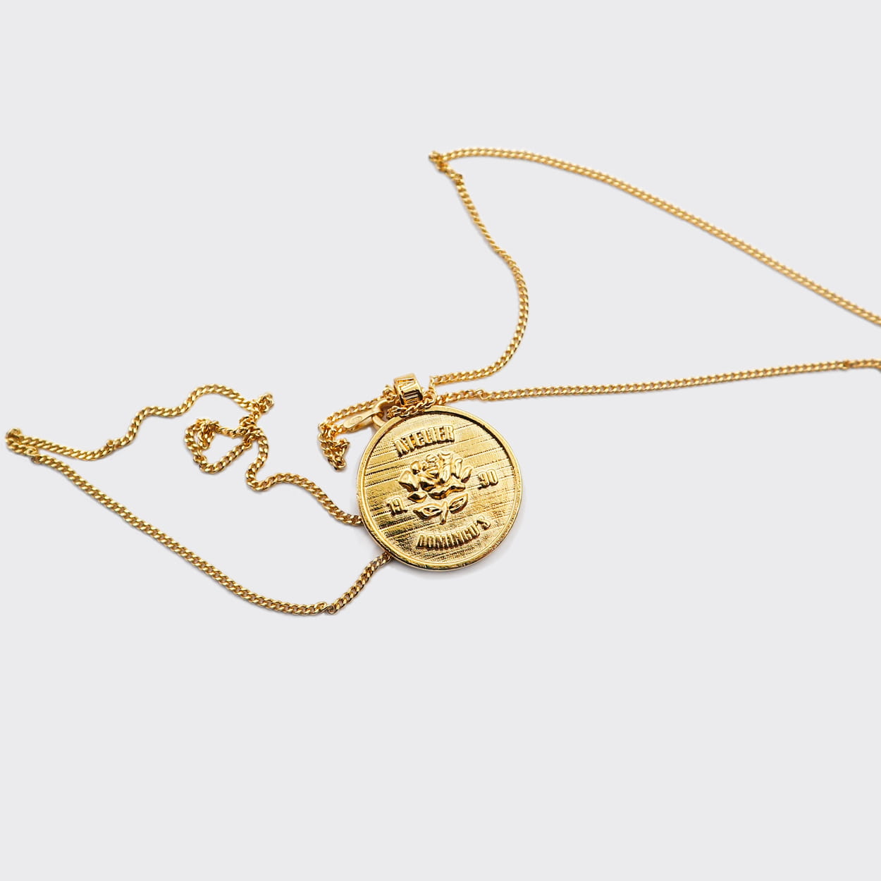 Atelier Domingo's State of Mind gold necklace is designed in France and made in Spain. This necklace is unisex, made for both men and women. The pendant is made of a high-quality 24 karat gold plating. The cuban chain is made of solid 925 Sterling silver with a high-quality 18 karat gold plating.
