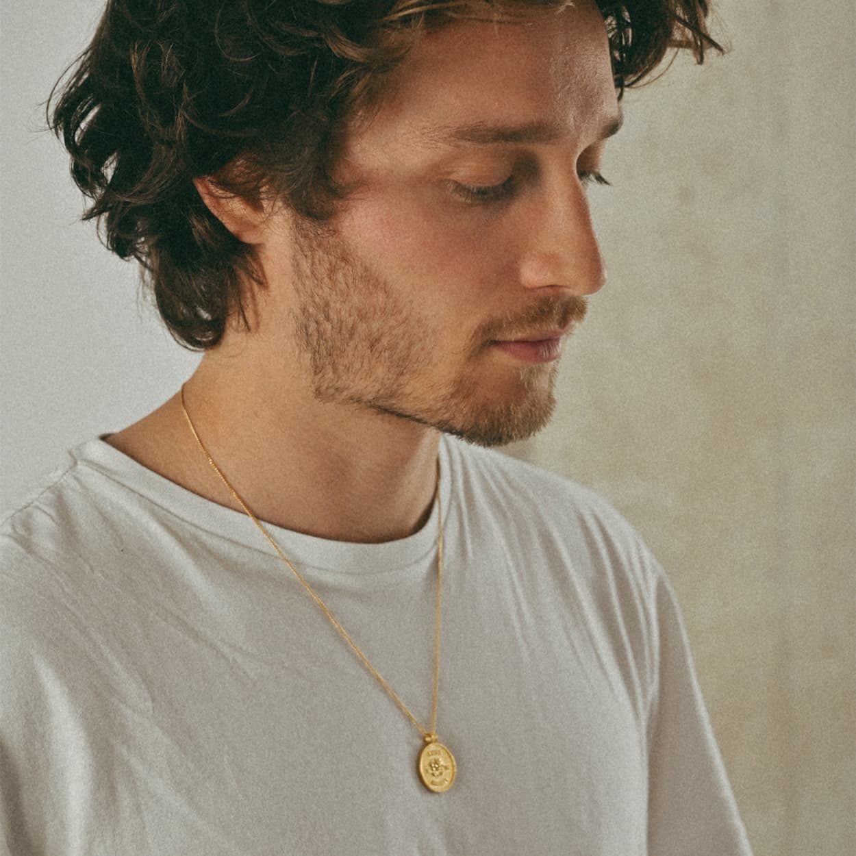 Atelier Domingo's State of Mind gold necklace is designed in France and made in Spain. This necklace is unisex, made for both men and women. The pendant is made of a high-quality 24 karat gold plating. The cuban chain is made of solid 925 Sterling silver with a high-quality 18 karat gold plating.