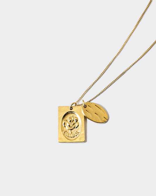 Atelier Domingo's L'Amour necklace is made in Spain. This jewelry is unisex. It is for both men and women.  The pendant is made of a high-quality 24 karat gold plating. The cuban chain is made of solid 925 Sterling silver with a high-quality 18 karat gold plating.