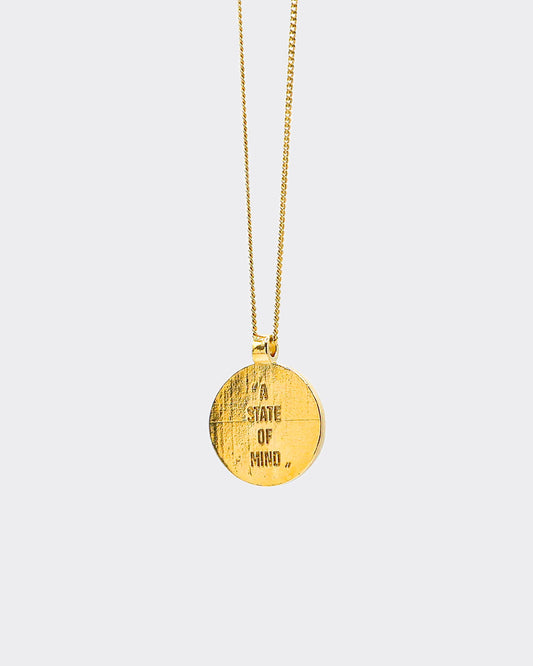 Atelier Domingo's State of Mind gold necklace is designed in France and made in Spain. This necklace is unisex, made for both men and women. The pendant is made of a high-quality 24 karat gold plating. The cuban chain is made of solid 925 Sterling silver with a high-quality 18 karat gold plating.