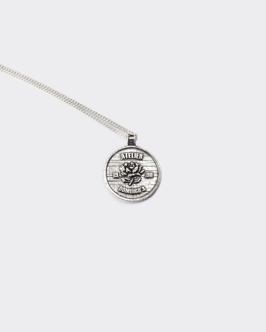 Atelier Domingo's State of Mind silver necklace is designed in France and made in Spain. This necklace is unisex, made for both men and women. The pendant is made of a high-quality 925 Sterling silver plating. The cuban chain is made of solid 925 Sterling silver.