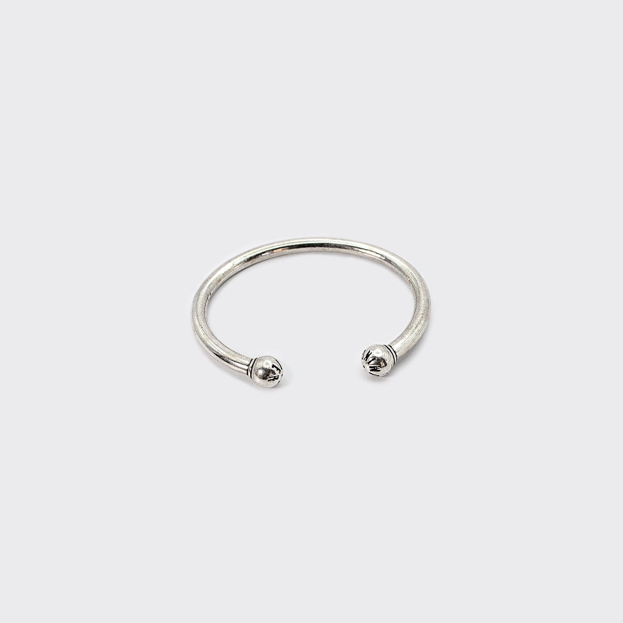 Atelier Domingo's bangle is made of a high-quality 925 Sterling silver plating (10 microns). It is adjustable to any wrist. It is made in Spain and for both men and women.